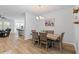 Elegant dining room with a stylish chandelier and views into the adjacent living area at 68 Red Bluff St, Summerville, SC 29483
