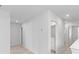 Hallway leading to a bathroom with neutral paint and carpet and recessed lighting at 68 Red Bluff St, Summerville, SC 29483