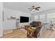 Comfortable living room with a large sectional sofa, ceiling fan and mounted flatscreen TV at 68 Red Bluff St, Summerville, SC 29483