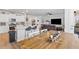 An open-concept kitchen, dining, and living space that creates a warm, cohesive and spacious area at 68 Red Bluff St, Summerville, SC 29483