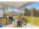 Enclosed patio with outdoor furniture and a view of a natural wooded area at 68 Red Bluff St, Summerville, SC 29483