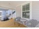 Outdoor patio with seating, a wooden deck, and view of the neighborhood at 68 Red Bluff St, Summerville, SC 29483
