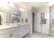 Elegant bathroom featuring a double sink vanity, a glass shower door, and neutral gray tones at 8703 Forte Dr, North Charleston, SC 29406