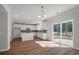 Spacious area featuring an open kitchen and dining with a view to the outside patio at 8703 Forte Dr, North Charleston, SC 29406