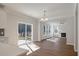 Bright open living space with sliding glass doors to the outside and flowing to kitchen at 8703 Forte Dr, North Charleston, SC 29406