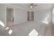 Bright main bedroom with a ceiling fan, walk-in closet, neutral walls, and plush carpet at 8703 Forte Dr, North Charleston, SC 29406