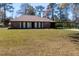 Charming brick ranch-style home featuring a carport and well-maintained lawn at 105 Wade Ct, Summerville, SC 29486