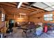 Spacious garage interior with wood walls, poker table, a sofa, and casual seating for entertainment at 105 Wade Ct, Summerville, SC 29486