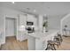 Bright kitchen featuring white cabinets, stainless appliances, and a quartz countertop island with seating at 108 Brown Swiss Cir, Summerville, SC 29483