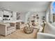 Open-concept living area with neutral colors, plush seating, and views into the modern kitchen at 108 Brown Swiss Cir, Summerville, SC 29483