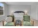 A well-lit main bedroom with plush seating arrangement and neutral decor at 108 Brown Swiss Cir, Summerville, SC 29483