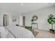 A view of the main bedroom, complete with simple decor and plenty of space for plants at 108 Brown Swiss Cir, Summerville, SC 29483