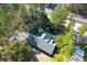 Aerial view showing the home's roof and backyard, surrounded by mature trees at 10812 Dorchester Rd, Summerville, SC 29485