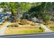 Aerial view of the property, showcasing its lush landscaping and surrounding greenery at 10812 Dorchester Rd, Summerville, SC 29485