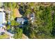 Aerial view of a charming home nestled among lush trees with private driveway at 10812 Dorchester Rd, Summerville, SC 29485