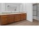 Bathroom boasts double vanity, wood cabinets, and modern fixtures at 10812 Dorchester Rd, Summerville, SC 29485