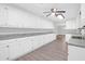 Bright kitchen featuring an abundance of white cabinets and modern ceiling lighting at 10812 Dorchester Rd, Summerville, SC 29485