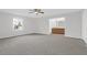 Spacious main bedroom with carpet and a view of the bathroom with wood cabinets at 10812 Dorchester Rd, Summerville, SC 29485