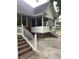 Inviting back porch with brick steps and white railings perfect for outdoor relaxation and entertaining at 112 Amanda Cir, Goose Creek, SC 29445
