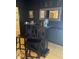 Stylish bar area with decorative mirror, seating, and elegant accessories create a perfect space for entertaining at 112 Amanda Cir, Goose Creek, SC 29445