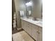 Modern bathroom with double vanity, marble countertop, and a fluffy white rug creating a spa-like oasis at 112 Amanda Cir, Goose Creek, SC 29445