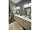 Bright bathroom featuring a double sink vanity with quartz countertop and decorative ladder at 112 Amanda Cir, Goose Creek, SC 29445
