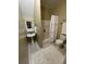 Cozy bathroom featuring a pedestal sink, fluffy white rug, and tub with ruffled shower curtain at 112 Amanda Cir, Goose Creek, SC 29445
