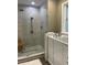 Sleek bathroom featuring a glass-enclosed shower, soaking tub, and tiled walls at 112 Amanda Cir, Goose Creek, SC 29445