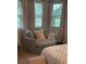 Cozy corner with chair and pillow with window views, creating a comfortable nook within the bedroom at 112 Amanda Cir, Goose Creek, SC 29445