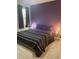 Bedroom showcases black, white, and purple bedding and modern glass side tables with lighting at 112 Amanda Cir, Goose Creek, SC 29445