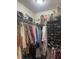Walk-in closet with ample storage for clothing and accessories, including wigs and handbags at 112 Amanda Cir, Goose Creek, SC 29445