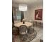 Charming dining area with round table, artistic rug, and decorative light fixture at 112 Amanda Cir, Goose Creek, SC 29445