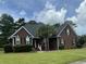 Charming brick home with a well-manicured lawn and mature landscaping, offering great curb appeal at 112 Amanda Cir, Goose Creek, SC 29445