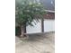 Spacious two-car garage with white doors and well-maintained driveway, framed by a lush tree at 112 Amanda Cir, Goose Creek, SC 29445