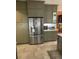 A stainless steel refrigerator complements the neutral cabinets in this freshly remodeled kitchen at 112 Amanda Cir, Goose Creek, SC 29445
