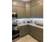 View of a kitchen with tiled backsplash, stainless steel oven, microwave, and neutral colored cabinets at 112 Amanda Cir, Goose Creek, SC 29445