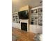 Bright living room with built-in bookshelves and a fireplace at 112 Amanda Cir, Goose Creek, SC 29445