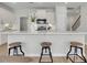 Modern kitchen featuring a large island with seating, stainless steel appliances, and bright lighting at 114 Brown Swiss Cir, Summerville, SC 29483