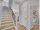 Staircase leading upstairs with hardwood steps and a white banister at 114 Brown Swiss Cir, Summerville, SC 29483