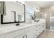 Modern bathroom with dual sinks, quartz countertop, black hardware and large mirrors at 115 Winding Branch Dr, Summerville, SC 29486