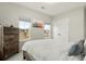 Comfortable bedroom featuring a rustic wood bed frame and closet for storage at 115 Winding Branch Dr, Summerville, SC 29486