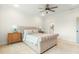 Bright bedroom with ceiling fan and side tables adjacent to the ensuite bathroom entrance at 115 Winding Branch Dr, Summerville, SC 29486