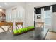 Dining room with decorative apples on the dining table, next to the kitchen with an open concept feel at 115 Winding Branch Dr, Summerville, SC 29486