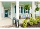 Inviting front porch with comfortable seating, stylish decor, and manicured landscaping, perfect for outdoor living at 115 Winding Branch Dr, Summerville, SC 29486