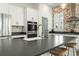 Spacious kitchen island with a farmhouse sink, sleek countertops, and ample storage, perfect for meal prep at 115 Winding Branch Dr, Summerville, SC 29486