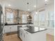 Modern kitchen with white cabinetry, stainless steel appliances, a large island, and rustic brick accents at 115 Winding Branch Dr, Summerville, SC 29486
