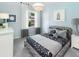 Comfortable bedroom with unique decor, soft lighting, and a window, offering a cozy and inviting atmosphere at 117 Royal Cainhoy Way, Huger, SC 29450