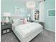 Cheerful bedroom featuring a plush bed, bright décor, and a large window, providing a comfortable space at 117 Royal Cainhoy Way, Huger, SC 29450
