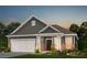 Charming single-story home with brick accents, a two-car garage, and a well-maintained front lawn at 117 Royal Cainhoy Way, Huger, SC 29450