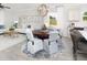 Open concept living space with elegant dining area, comfortable seating, and natural light at 117 Royal Cainhoy Way, Huger, SC 29450
